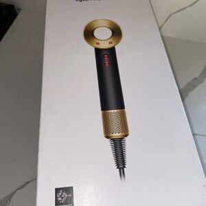 Dyson Hair Dryer in Black and Gold with Red Accents